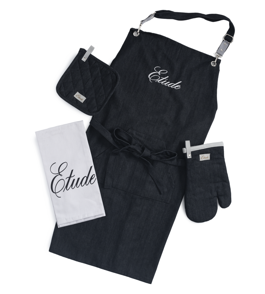 Black linen apron, oven mitt, pot holder, and tea towel set.  "Etude" embroidered on apron.