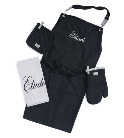 Black linen apron, oven mitt, pot holder, and tea towel set.  "Etude" embroidered on apron.