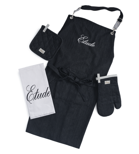 Black linen apron, oven mitt, pot holder, and tea towel set.  "Etude" embroidered on apron.